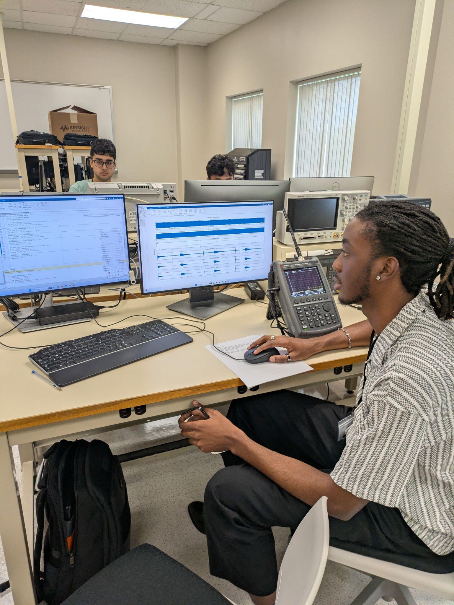 Working at a signal-analysis workstation during the NSF-Funded Spectrum Sizzle Workshop